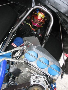 In the cockpit of her Girl Trouble Funny Car, Courtney Mageau