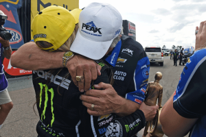 Brittany Force embraces her dad after her win